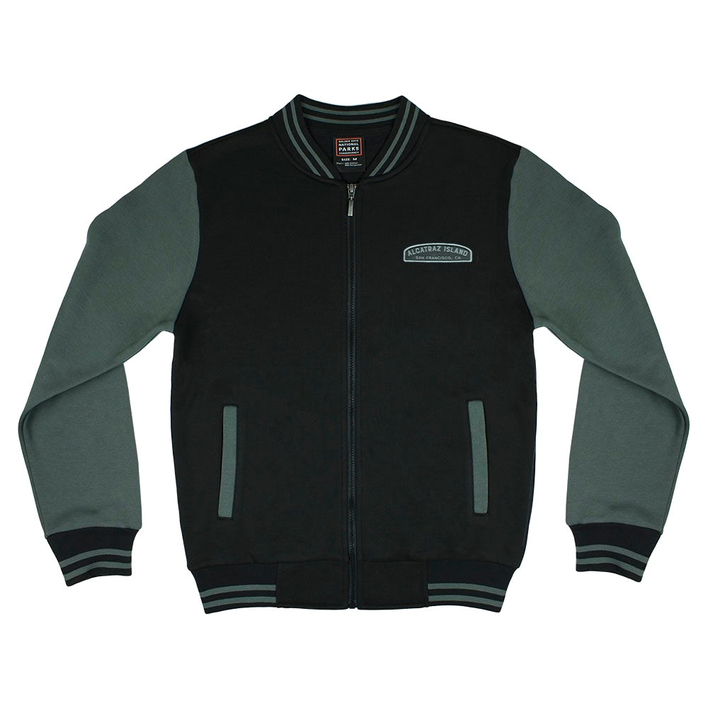 Black varsity style Alcatraz jacket with grey sleeves, by the Golden Gate National Parks Conservancy