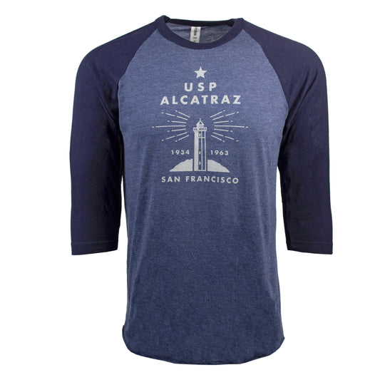 Blue Alcatraz t-shirt featuring crew neck fit, retro-chic screen-printed design of Alcatraz lighthouse on chest, 3/4 length navy blue raglan sleeve