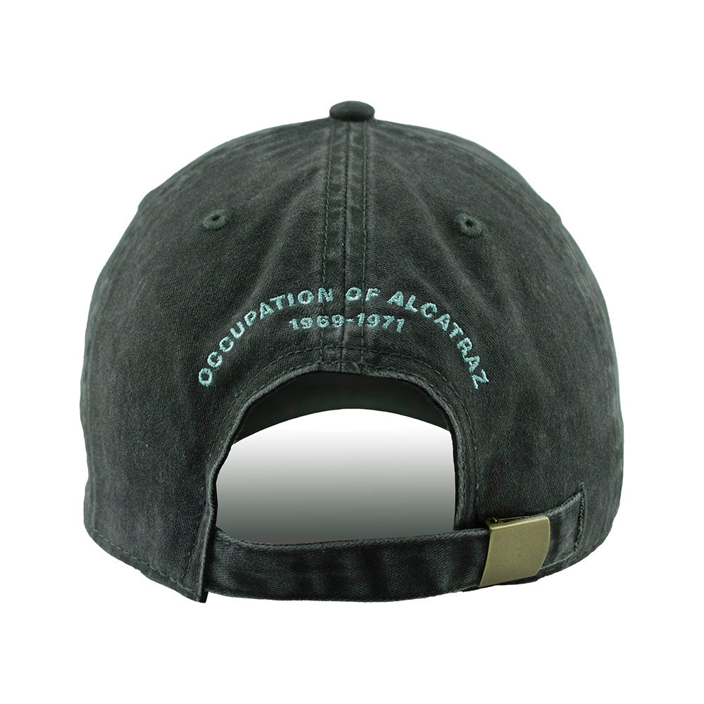 Black cap with 'Occupation of Alcatraz 1969-1971' text embroidered in blue on back side