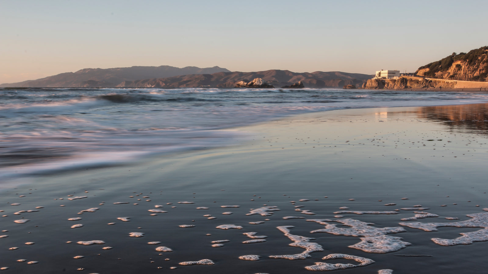 A view looking at the Cliff House and Marin Headlands from San Francisco's Ocean Beach.