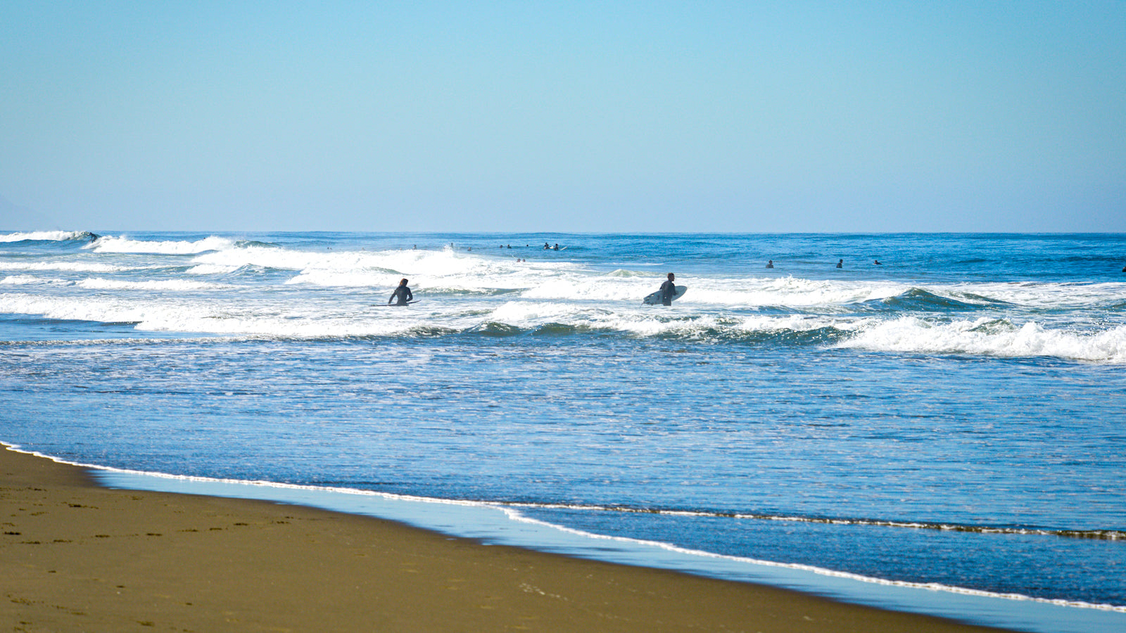 Surfers in the waves at San Francisco's Ocean Beach