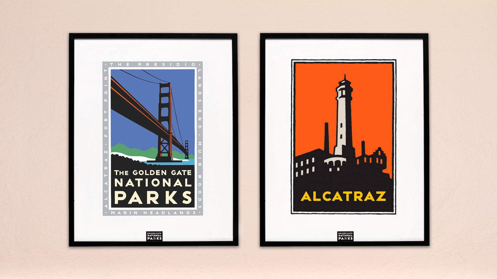Two framed posters hang on a peach wall, Golden Gate National Parks and Alcatraz.