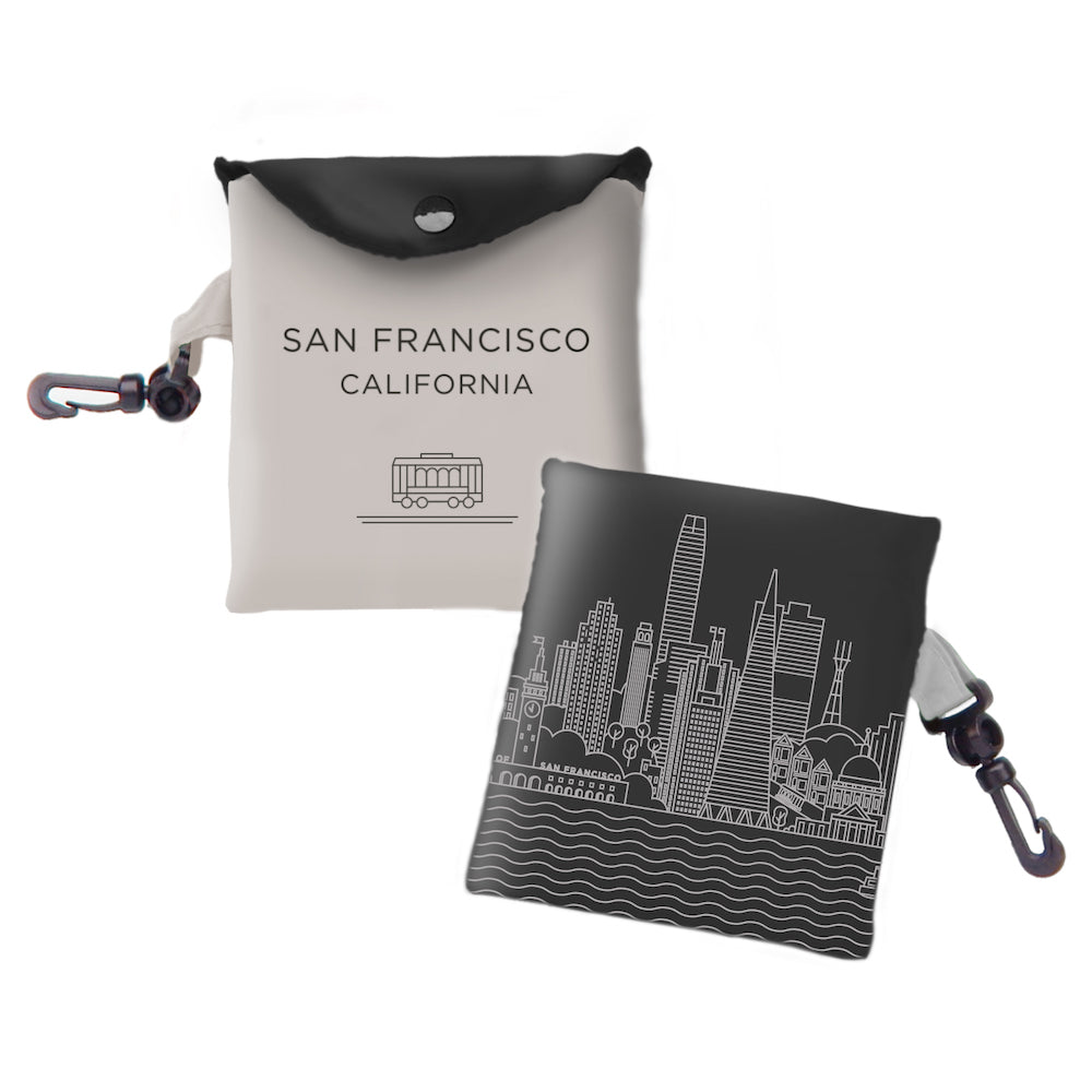 Tote bag with San Francisco California text and cable car image in black on one side and  building illustration  in white on other side.