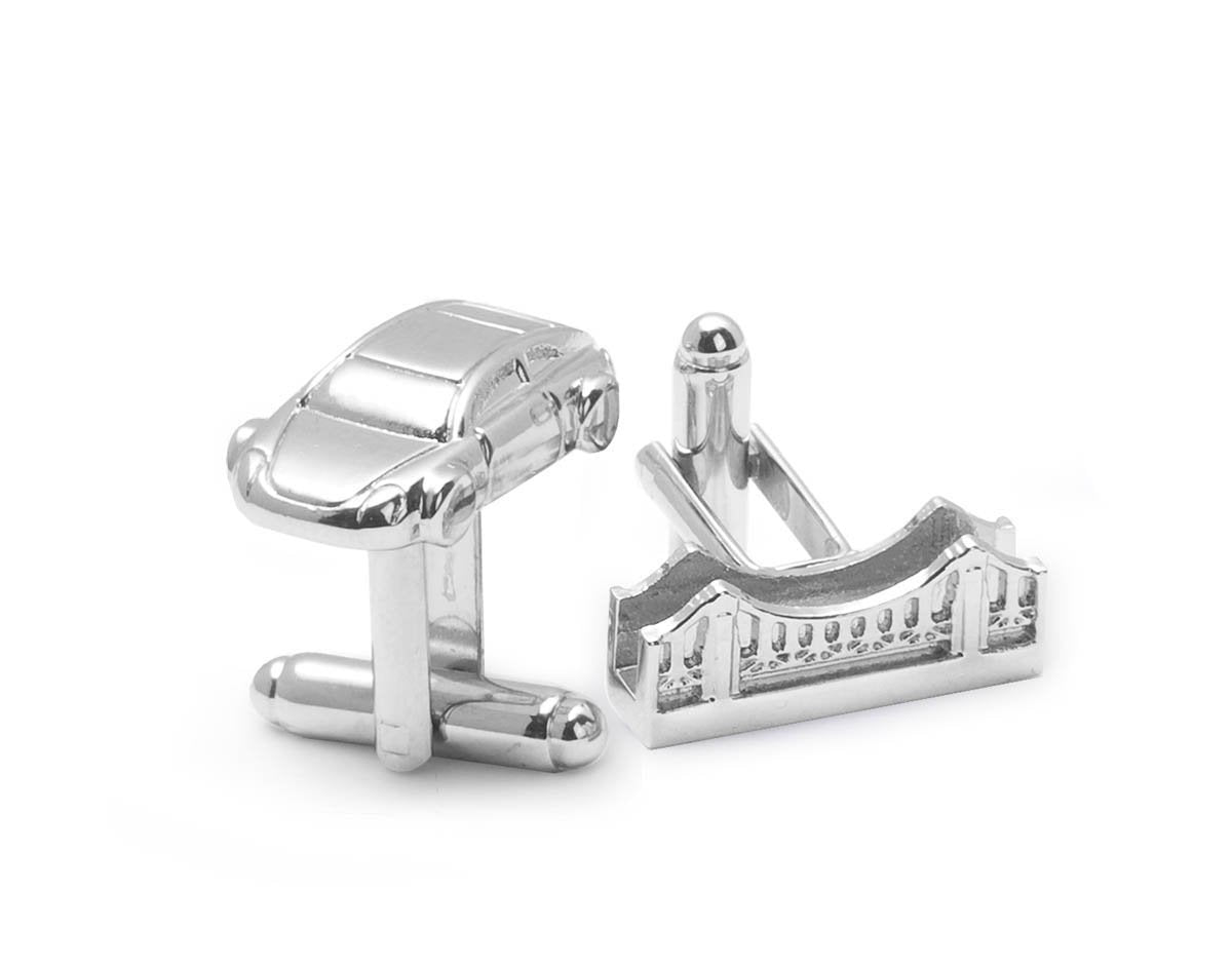 Mirror-finish silver cuff link set with one Golden Gate Bridge and one car.