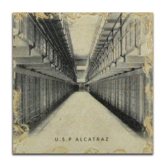 Vintage-inspired coaster featuring an historical photo of Alcatraz cellhouse Broadway, tumbled marble with weathered finish.