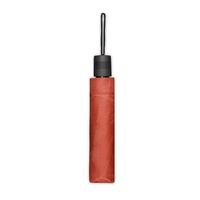 Small travel orange umbrella with black handle