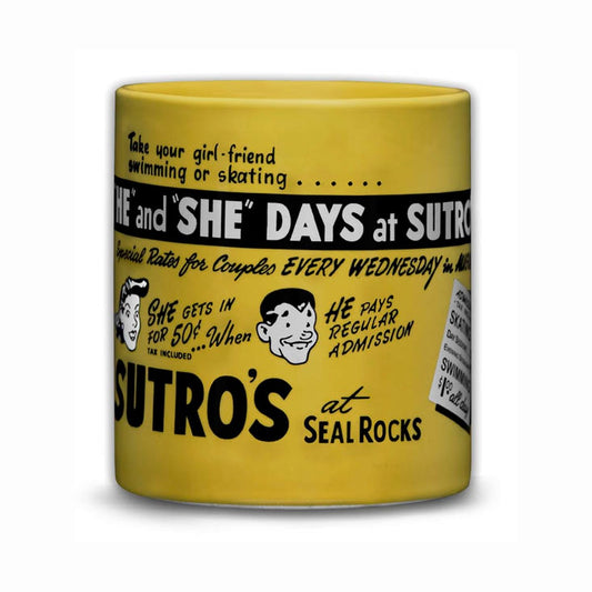 Oversize yellow mug with black and white cartoon drawings of a man’s and woman’s face and accompanying text, based on vintage advertisements for “He” and “She” Days at Sutro Baths.