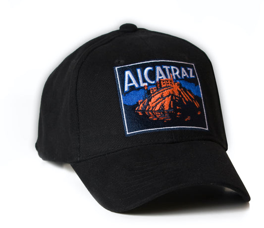 Black baseball cap with colorful embroidered Alcatraz at Night design on front panels.