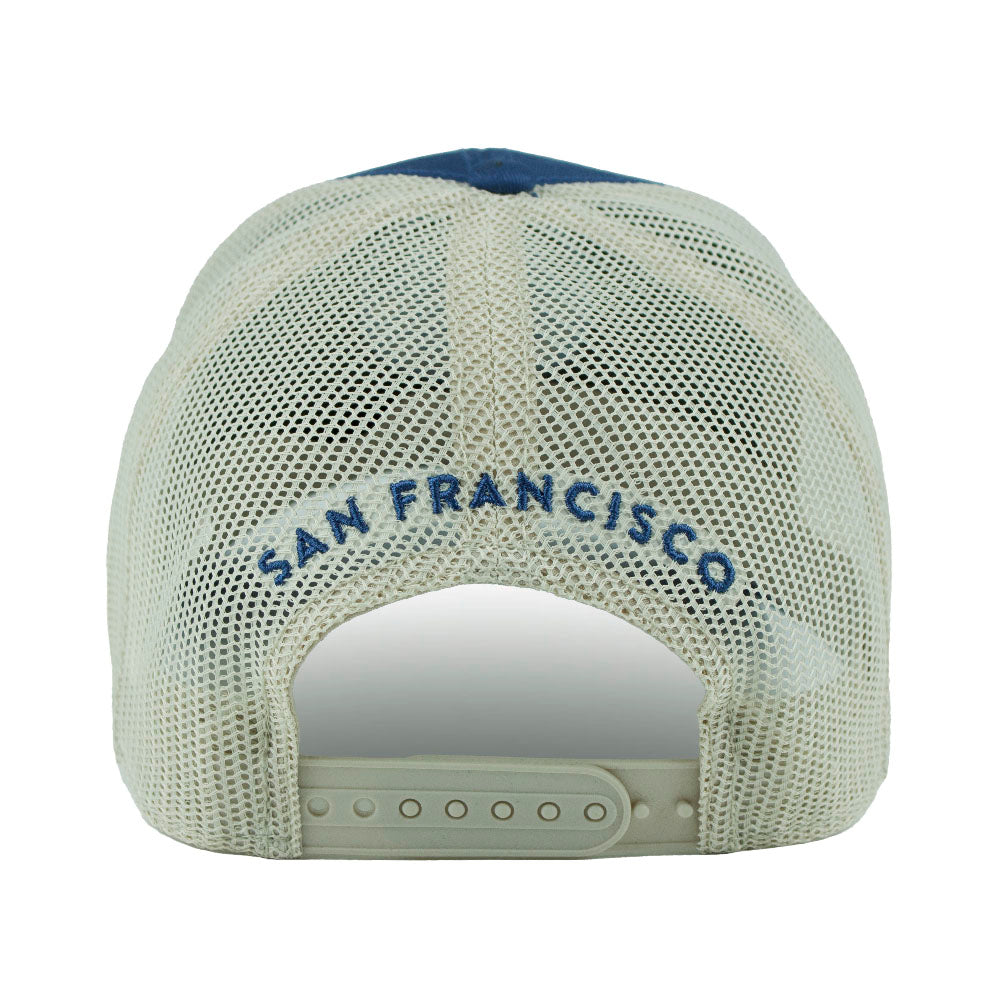 Back view of a blue and cream colored mesh trucker cap with 'San Francisco' text embroidered