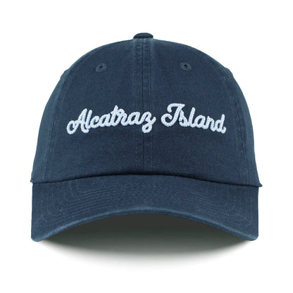 Navy blue cap with 'Alcatraz Island' text on a white background