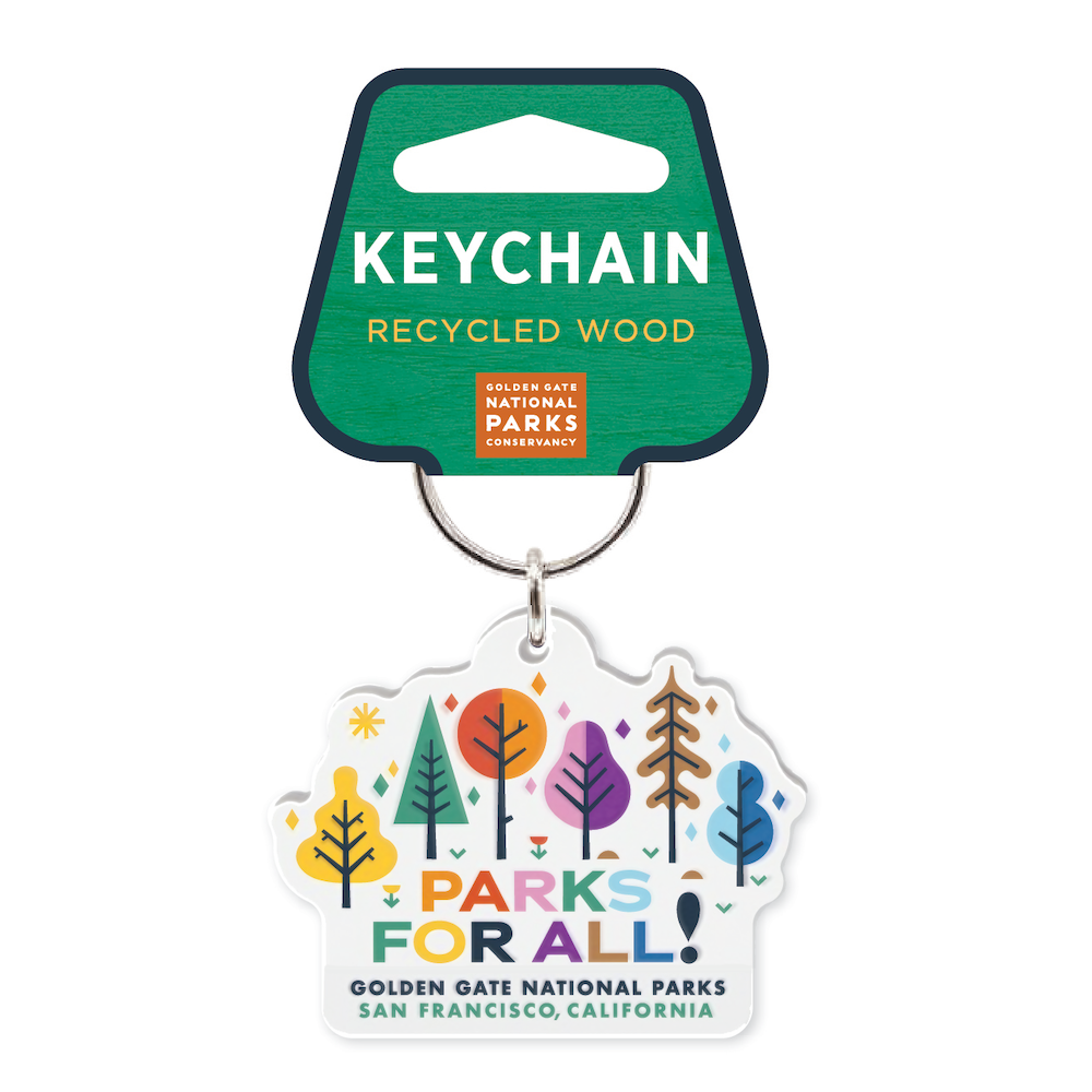 Colorfully illustrated keychain with slogan Parks for All and cheerfully colored trees and flowers, made by the Golden Gate National Parks Conservancy