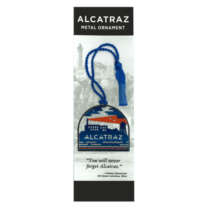 Metal Alcatraz Island ornament with colorful printed design, made by the Golden Gate National Parks Conservancy, packaged with interpretive card