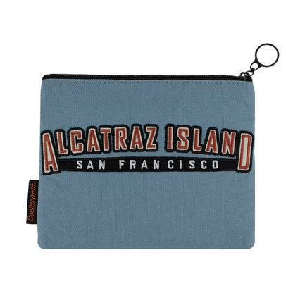 Blue zipper pouch with 'Alcatraz Island San Francisco' embroidered text in red, white, and black