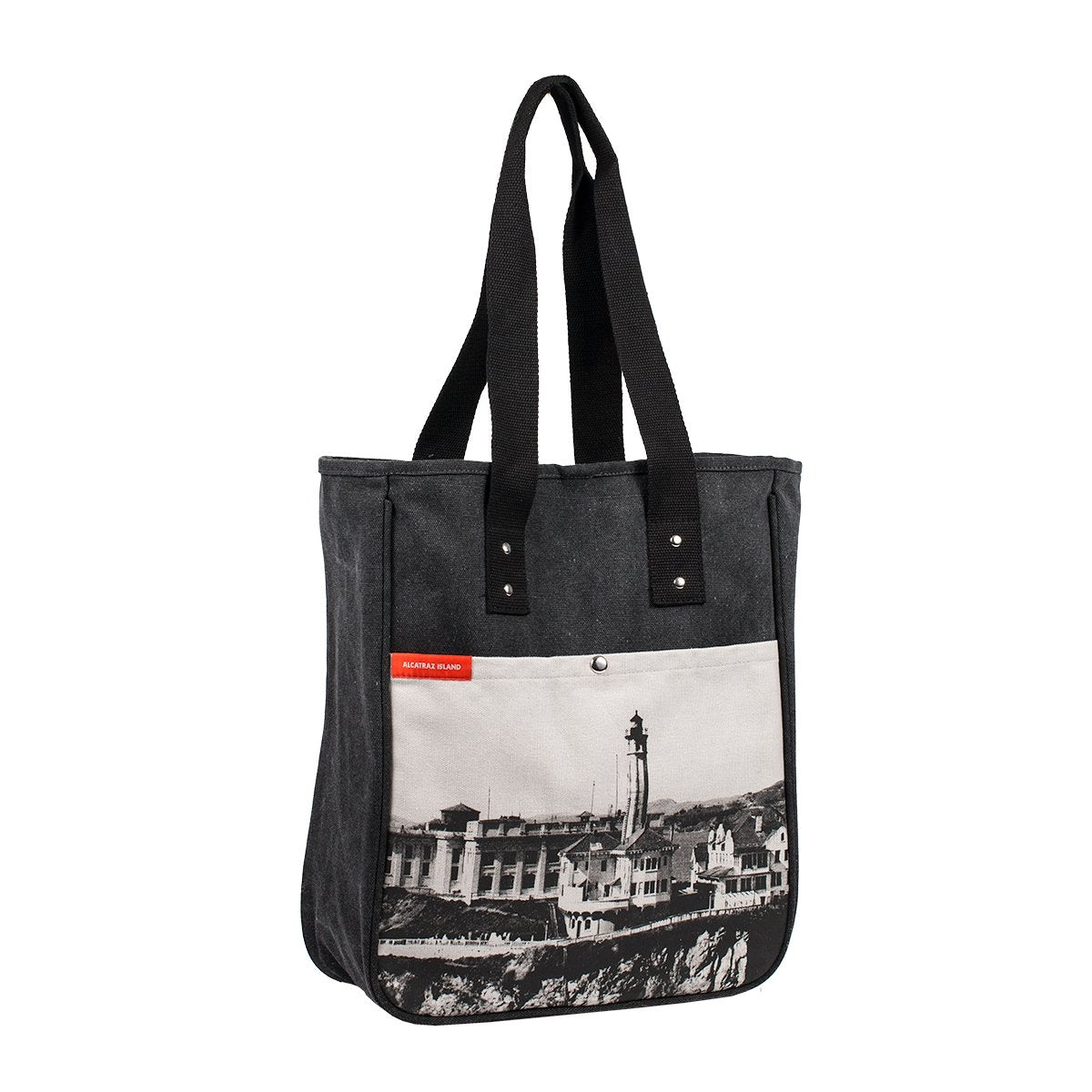 Grey tote bag with black-and-white photograph of Alcatraz Island lighthouse on front pocket.