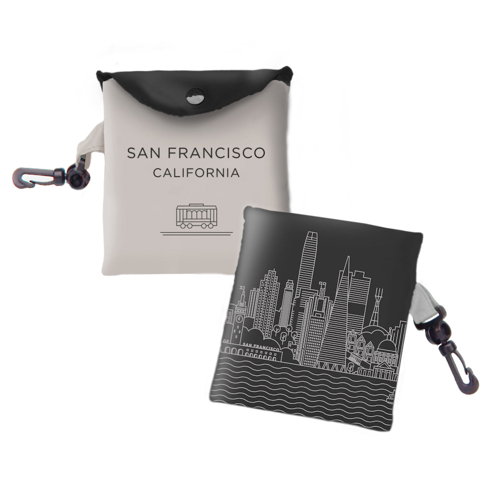Tote bag with San Francisco California text and cable car image in black on one side and  building illustration  in white on other side. 