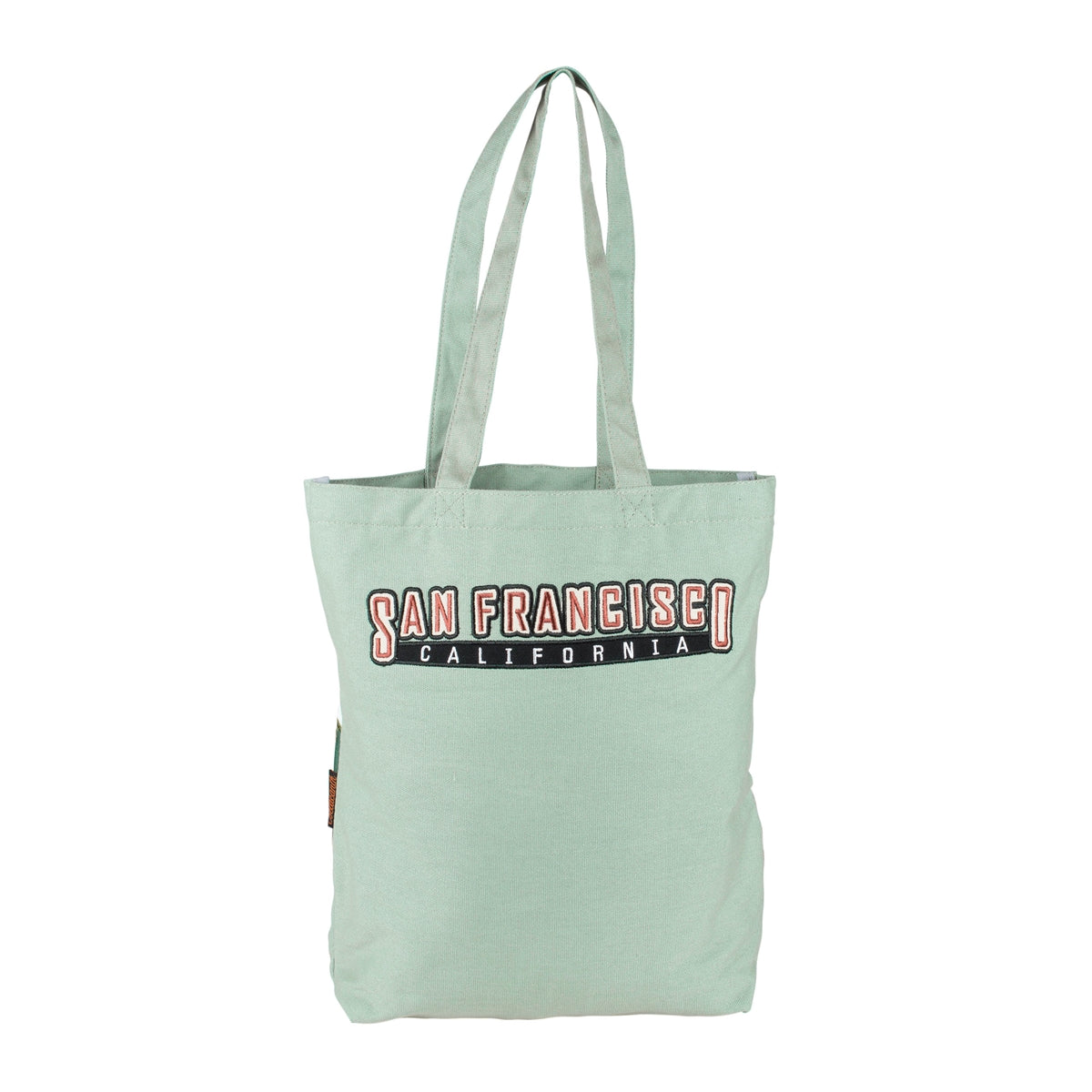 Pale green tote bag with embroidered text "San Francisco California" in red, white, and black.