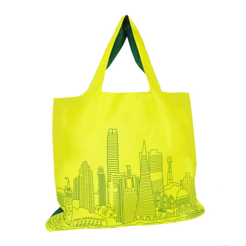 Tote bag with San Francisco building illustration printed on body in green on yellow background.