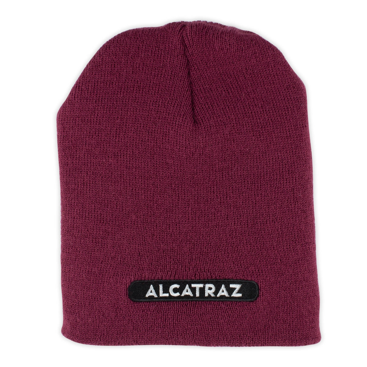 Maroon knit cap with white and black patch at brim that reads "Alcatraz."