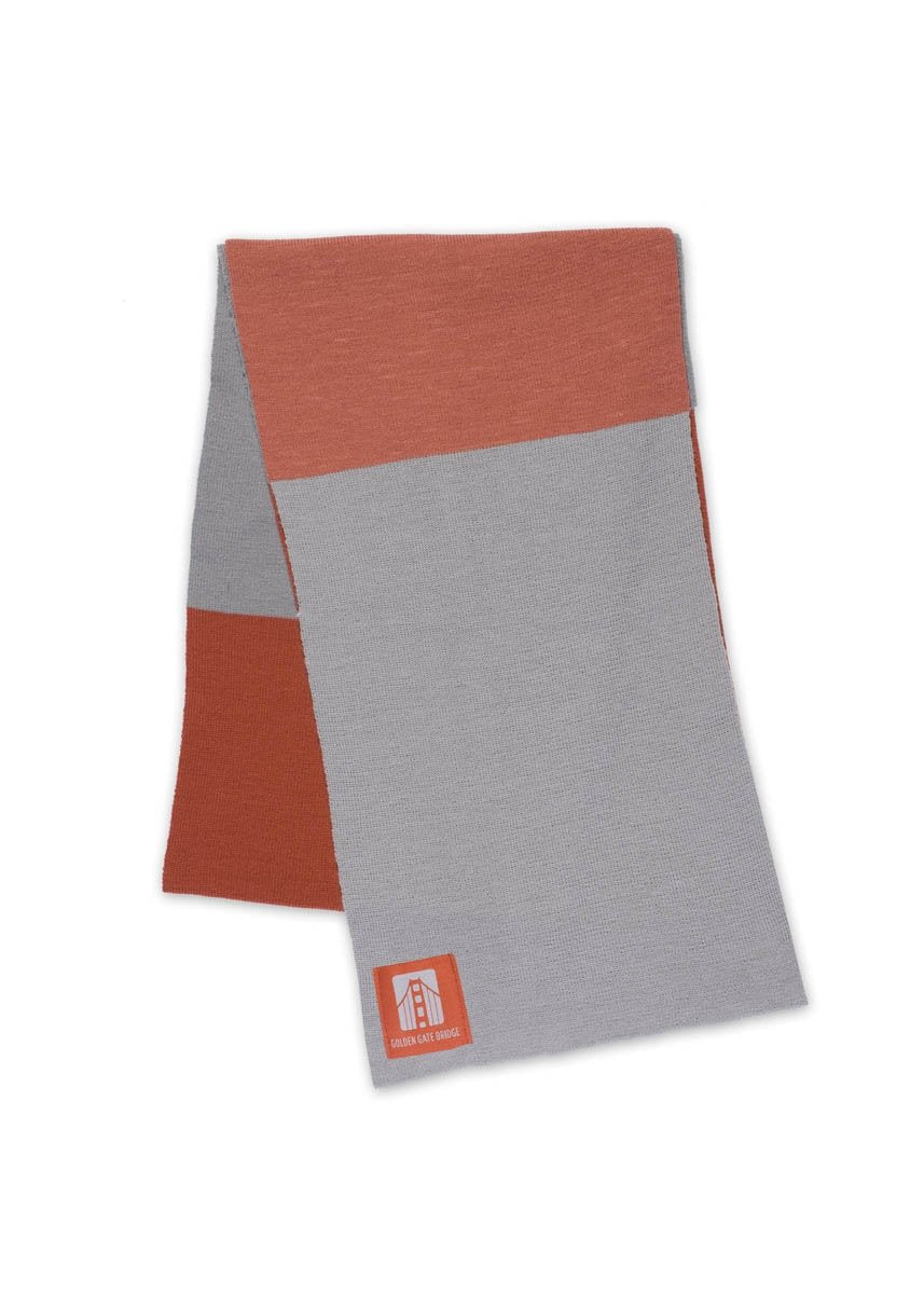 Multicolor grey and orange color block knit scarf with Golden Gate Bridge woven patch label.