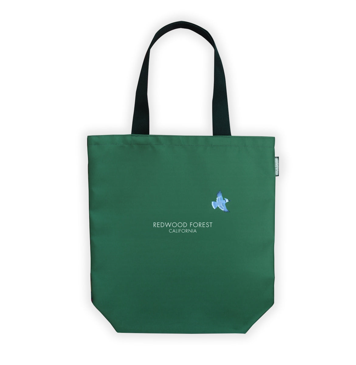 Green tote bag with black handle, words "Redwood Forest California" printed in white at center with illustration of blue bird.