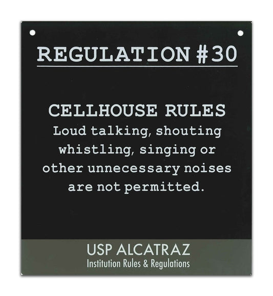 Black and grey decorative metal sign with Alcatraz Regulation 30 ("unnecessary noises are not permitted...") printed in white.