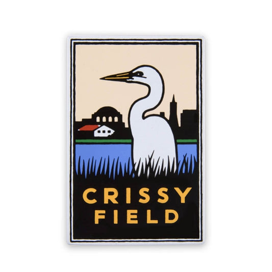 Rectangular magnet with colorful illustration of egret in shoreline marsh, with San Francisco skyline behind. Orange text “Crissy Field” at bottom. Art by Michael Schwab.