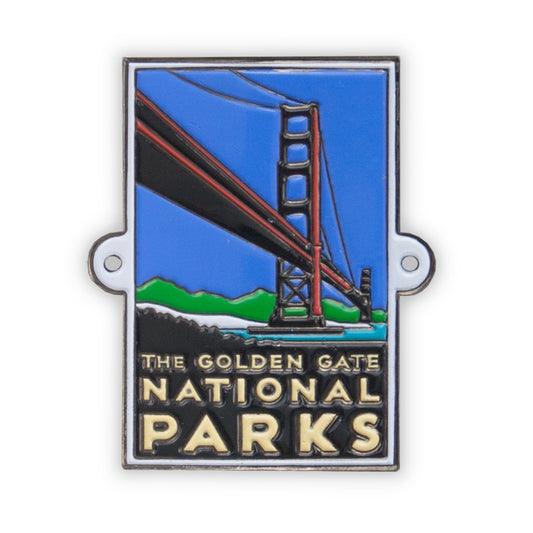 Multicolor metal hiking stick medallion with design of Golden Gate National Parks Bridge, based on artwork by Michael Schwab.