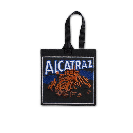 Multicolor embroidered luggage tag with design of Alcatraz Island, America's most notorious former prison, at night.