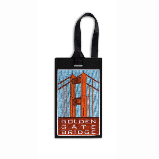 Multicolor embroidered souvenir luggage tag featuring vintage-inspired illustration of Golden Gate Bridge Art Deco towers.