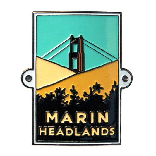 Multicolor souvenir metal hiking stick medallion with design of Marin Headlands, based on artwork by Michael Schwab.