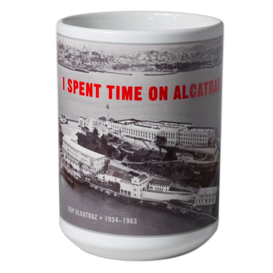 13 oz. white mug with red "I Spent Time on Alcatraz" slogan and historical black-and-white aerial photograph of the Rock.