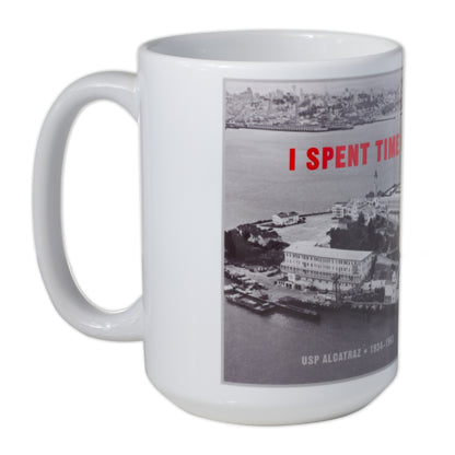 13 oz. white mug with red "I Spent Time on Alcatraz" slogan and historical black-and-white aerial photograph of the Rock.