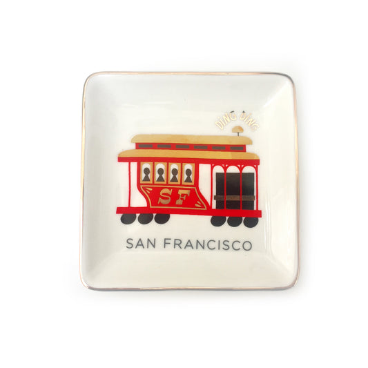 Small square ceramic dish featuring a colorful illustration of a San Francisco cable car with gold accents.