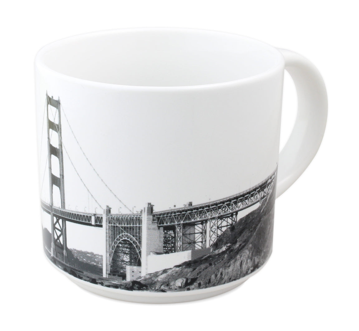 14 oz. white mug with black-and-white photo of the Golden Gate Bridge and "The Engineering Marvel of the Age" in black text.