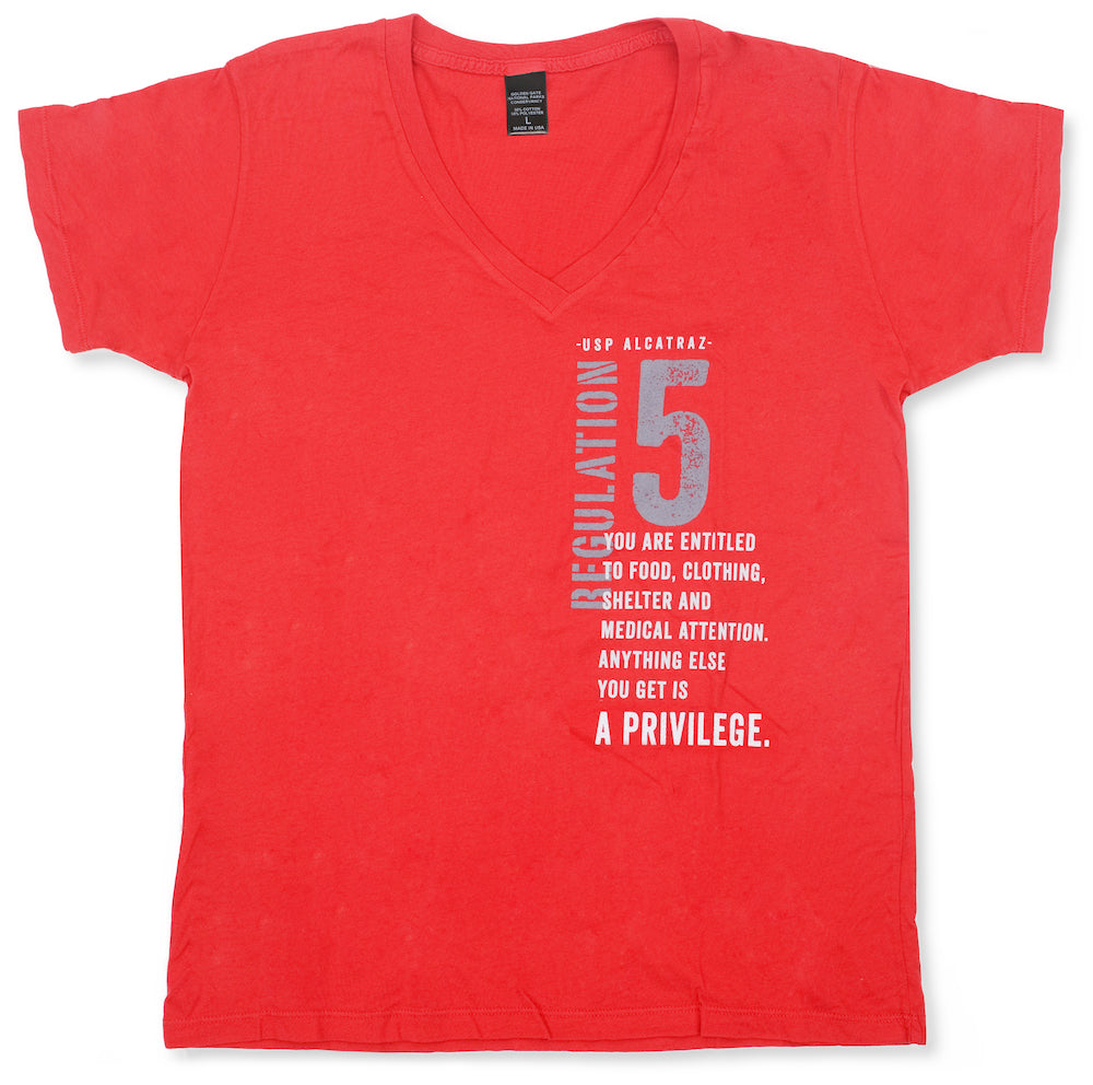 Bright red v-neck women's t-shirt, with grey and white design featuring text from U.S. Penitentiary Alcatraz Regulation 5: "You are entitled to food, clothing, shelter and medical attention. Anything else you get is a privilege."